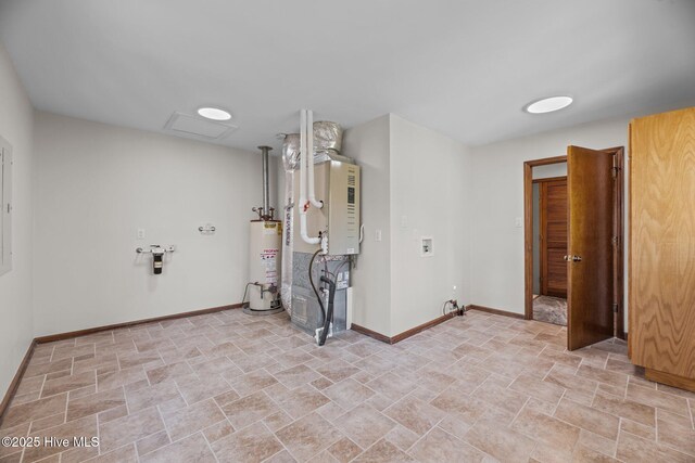 153 Windmill Point Dr, Vandemere, NC 28587 - below grade area with gas water heater, baseboards, stone finish flooring, and heating unit