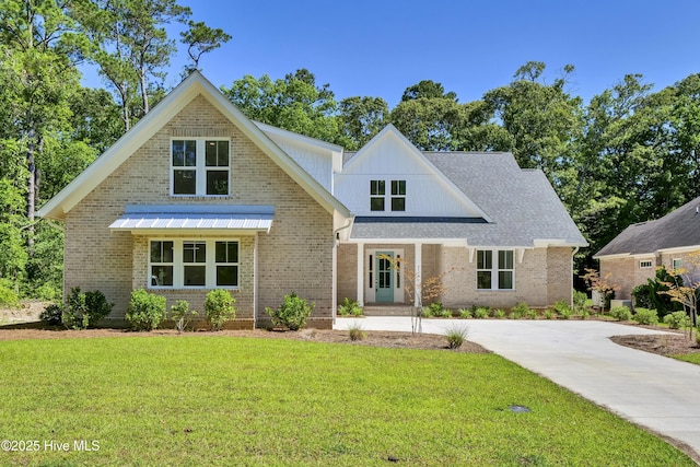 8241 Sage Valley Dr, Wilmington, NC 28411 - view of front of house with a front lawn and brick siding