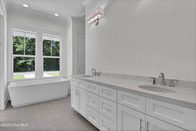 8241 Sage Valley Dr, Wilmington, NC 28411 - bathroom with double vanity, a soaking tub, tile patterned floors, recessed lighting, and crown molding