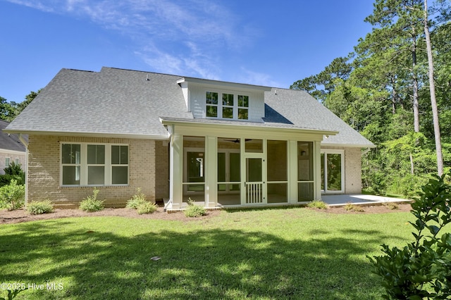 8241 Sage Valley Dr, Wilmington, NC 28411 - rear view of house featuring brick siding, a yard, a sunroom, and a patio area