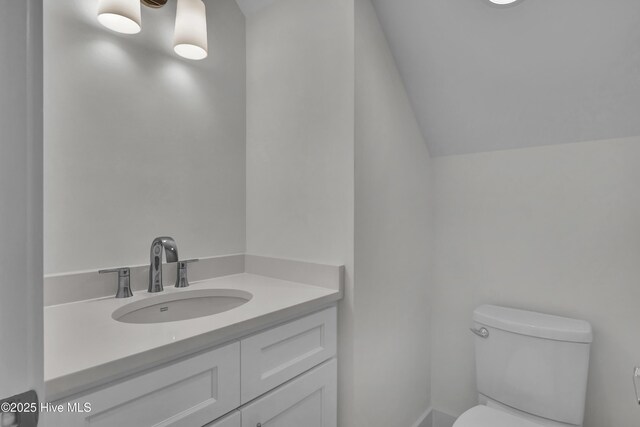 8241 Sage Valley Dr, Wilmington, NC 28411 - half bathroom with toilet, lofted ceiling, and vanity