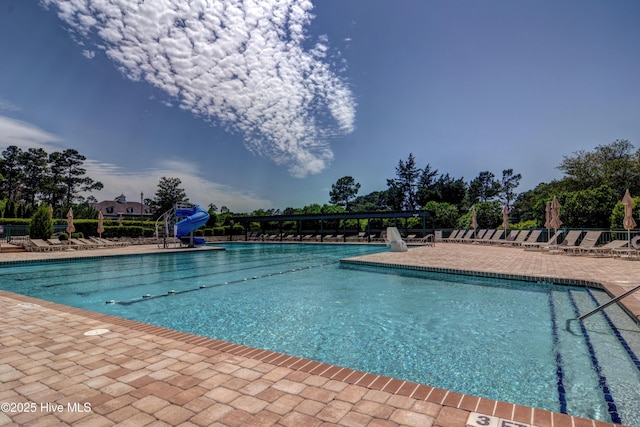 8241 Sage Valley Dr, Wilmington, NC 28411 - community pool featuring a water slide and a patio