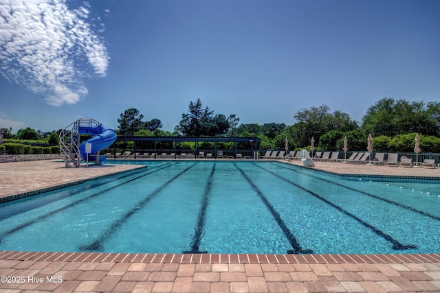 8241 Sage Valley Dr, Wilmington, NC 28411 - community pool featuring a water slide and a patio area
