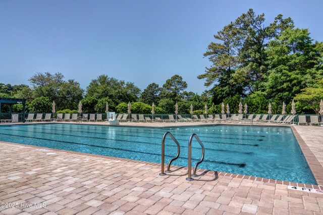 8241 Sage Valley Dr, Wilmington, NC 28411 - community pool featuring view of scattered trees and a patio area