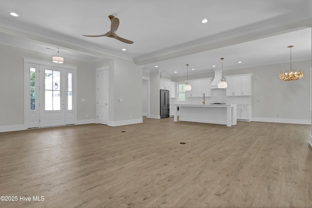 8241 Sage Valley Dr, Wilmington, NC 28411 - unfurnished living room with plenty of natural light, baseboards, recessed lighting, light wood finished floors, and ornamental molding