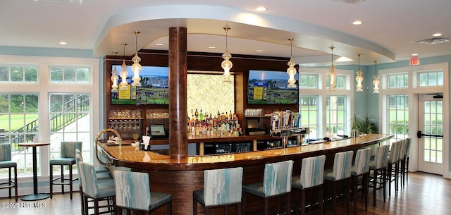 8241 Sage Valley Dr, Wilmington, NC 28411 - indoor wet bar with wood finished floors, hanging light fixtures, and recessed lighting