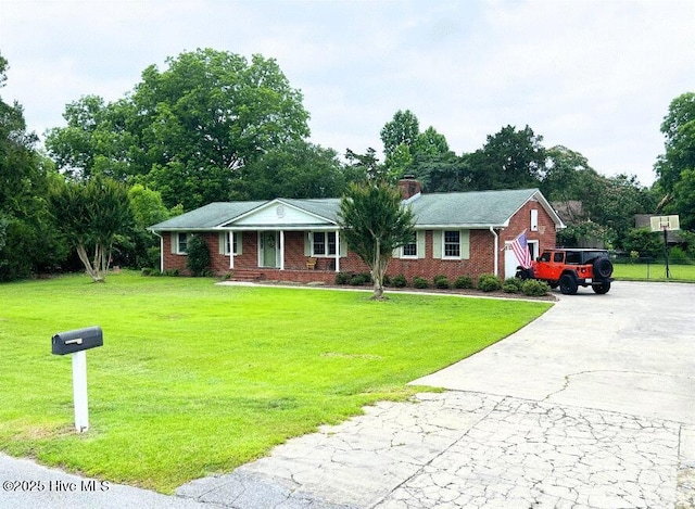 4912 Cypress Shores Dr, New Bern, NC 28562 - ranch-style home with driveway, a front lawn, brick siding, and a chimney