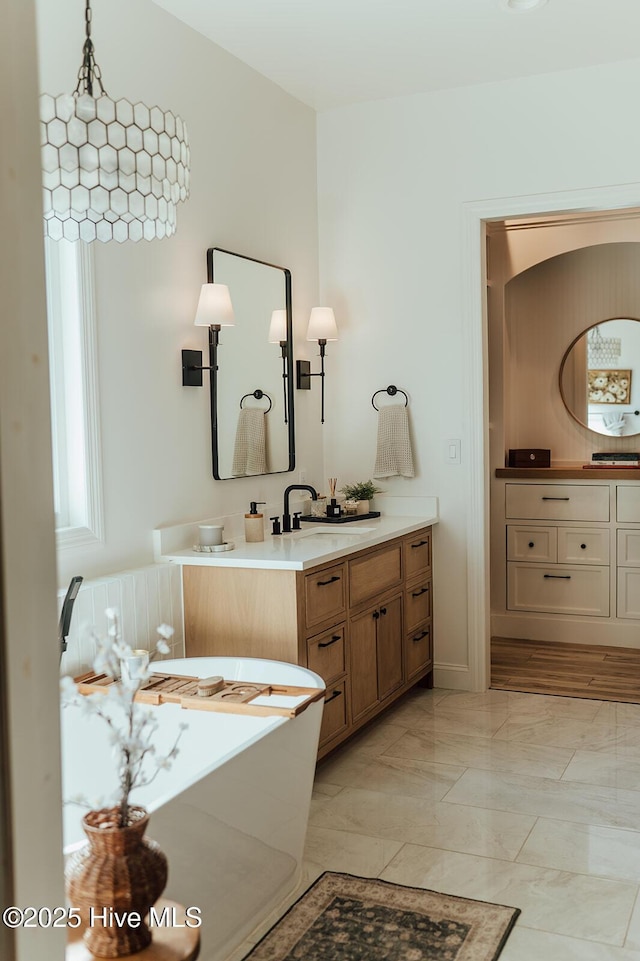 187 Royal Palms Way, Holly Ridge, NC 28445 - bathroom featuring vanity, marble finish flooring, and a soaking tub