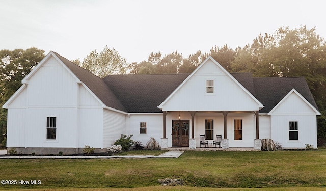 187 Royal Palms Way, Holly Ridge, NC 28445 - view of front of home featuring a porch and a front lawn