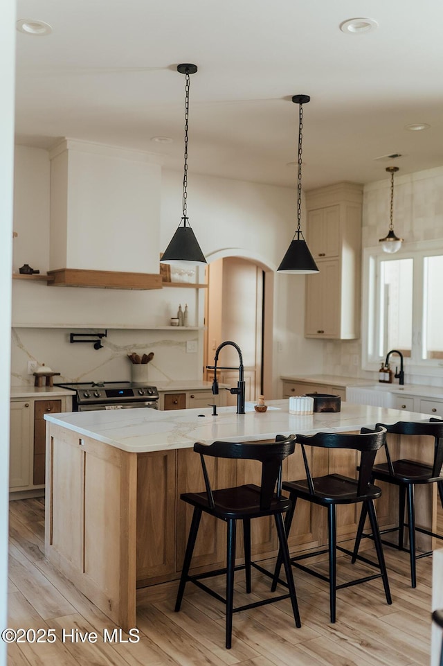 187 Royal Palms Way, Holly Ridge, NC 28445 - kitchen with stainless steel electric range, tasteful backsplash, light wood finished floors, a sink, and recessed lighting