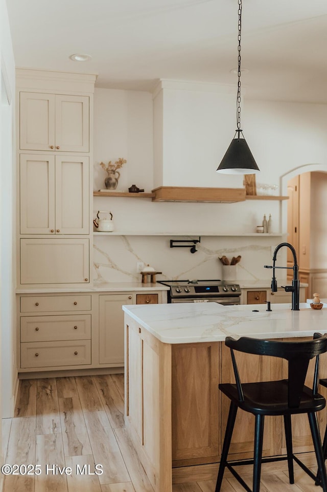 187 Royal Palms Way, Holly Ridge, NC 28445 - kitchen featuring open shelves, stainless steel range with electric stovetop, light stone countertops, a breakfast bar, and recessed lighting