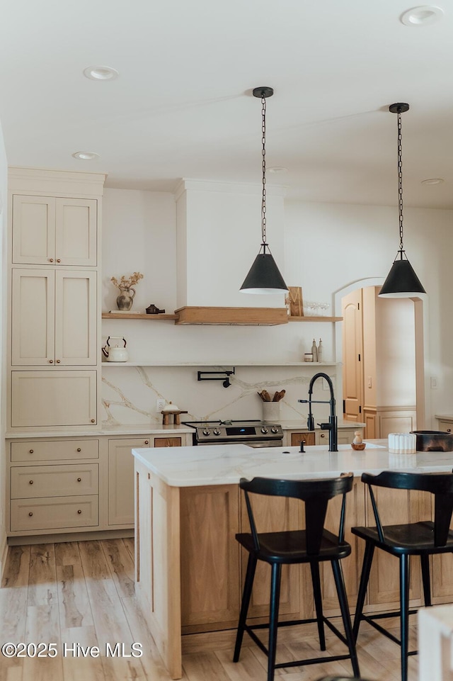 187 Royal Palms Way, Holly Ridge, NC 28445 - kitchen with open shelves, a breakfast bar, light wood finished floors, hanging light fixtures, and recessed lighting