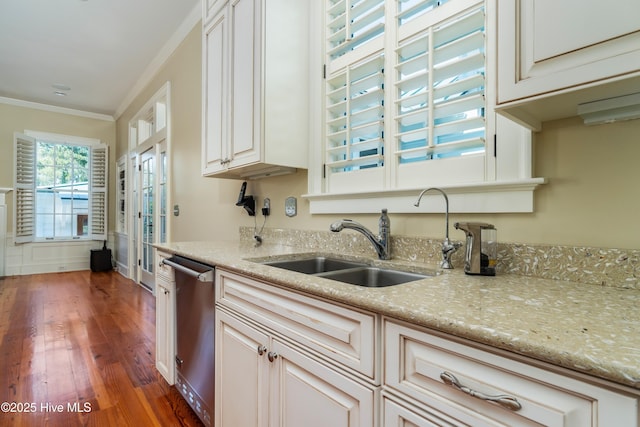 588 E Harborside Rd, Oriental, NC 28571 - kitchen with dishwasher, wood finished floors, crown molding, a sink, and light stone countertops