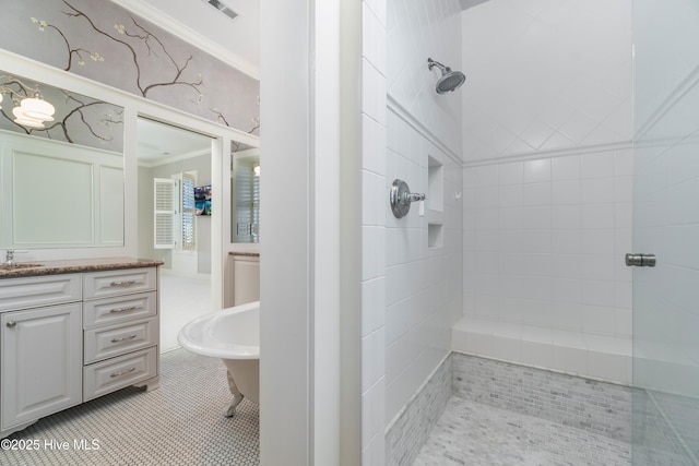 588 E Harborside Rd, Oriental, NC 28571 - bathroom featuring a tile shower, vanity, ornamental molding, and tile patterned floors