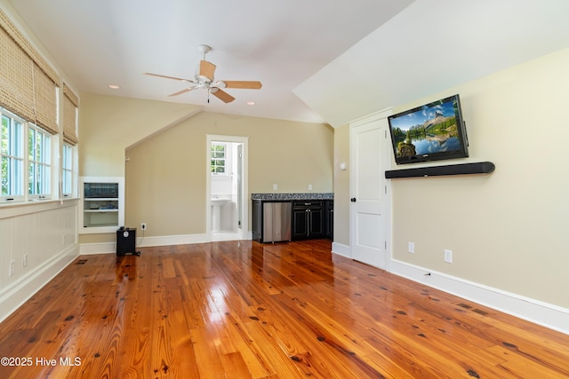 588 E Harborside Rd, Oriental, NC 28571 - unfurnished living room featuring a ceiling fan, wood finished floors, lofted ceiling, recessed lighting, and baseboards