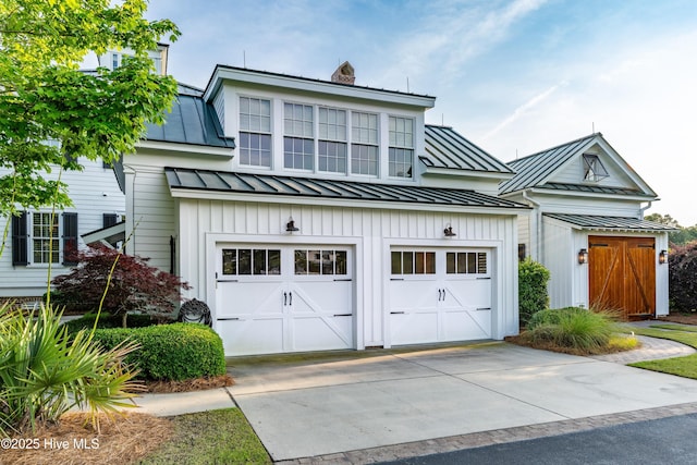 588 E Harborside Rd, Oriental, NC 28571 - view of front of property with a standing seam roof, concrete driveway, a chimney, metal roof, and an attached garage