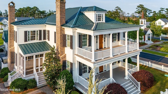 588 E Harborside Rd, Oriental, NC 28571 - back of house featuring a standing seam roof, metal roof, a chimney, and a porch