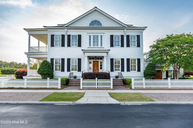 588 E Harborside Rd, Oriental, NC 28571 - greek revival house with a fenced front yard and a balcony