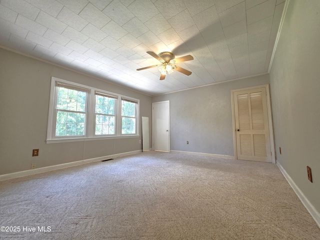 1700 Green Springs Rd, New Bern, NC 28560 - empty room featuring crown molding, carpet floors, a ceiling fan, and baseboards