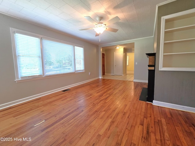 1700 Green Springs Rd, New Bern, NC 28560 - spare room featuring a ceiling fan, light wood-style floors, ornamental molding, and baseboards