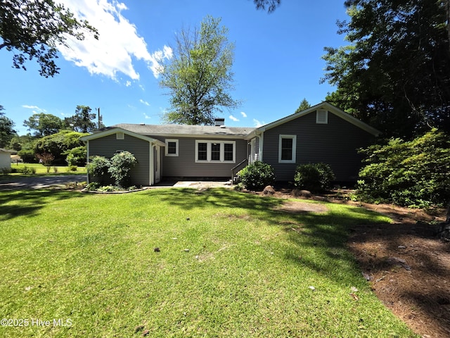 1700 Green Springs Rd, New Bern, NC 28560 - rear view of house featuring a yard and a chimney