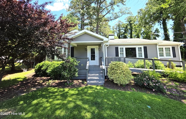 1700 Green Springs Rd, New Bern, NC 28560 - view of front of property featuring a front yard, a chimney, and covered porch
