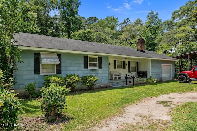 143 Ballard St, Chocowinity, NC 27817 - single story home featuring covered porch, a chimney, a front yard, and a garage