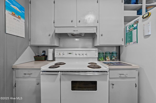 143 Ballard St, Chocowinity, NC 27817 - kitchen with white range with electric cooktop, light countertops, under cabinet range hood, and white cabinets