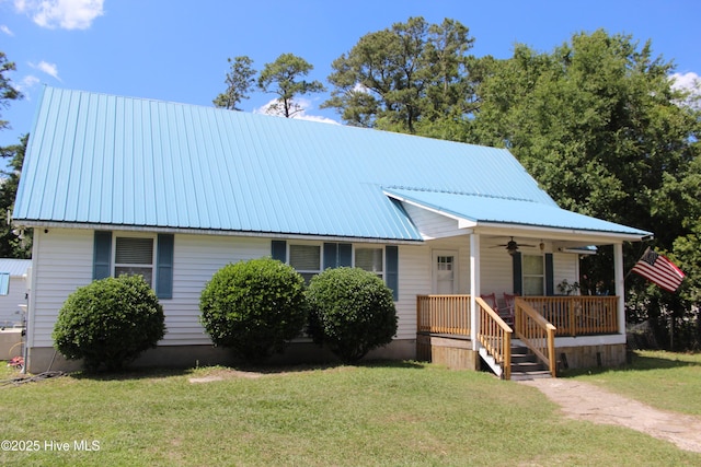121 Pine Grove Rd, Newport, NC 28570 - view of front of home featuring a ceiling fan, covered porch, a front yard, and metal roof