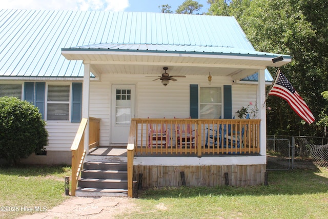 121 Pine Grove Rd, Newport, NC 28570 - view of front of house featuring ceiling fan, metal roof, and covered porch