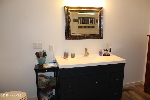 121 Pine Grove Rd, Newport, NC 28570 - bathroom with vanity, toilet, wood finished floors, and baseboards