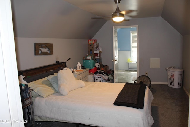 121 Pine Grove Rd, Newport, NC 28570 - bedroom with vaulted ceiling, carpet floors, ensuite bath, a ceiling fan, and baseboards