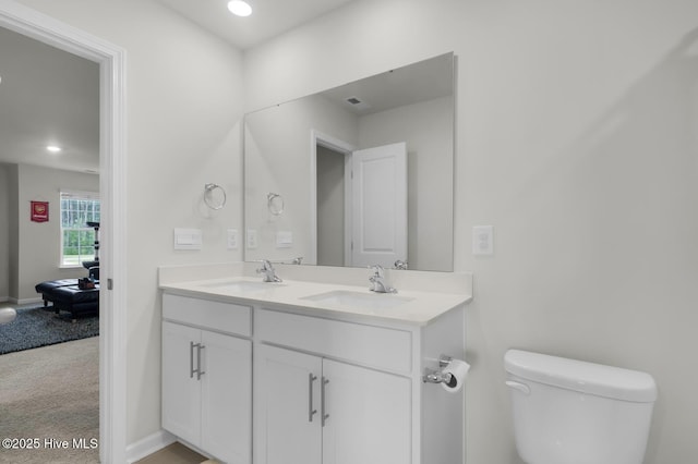 119 Perrytown Loop Rd, New Bern, NC 28562 - bathroom featuring toilet, double vanity, recessed lighting, and baseboards