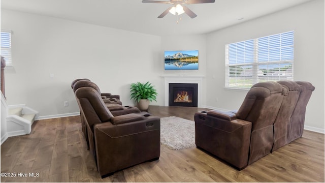 119 Perrytown Loop Rd, New Bern, NC 28562 - living area with ceiling fan, wood finished floors, a lit fireplace, baseboards, and stairs