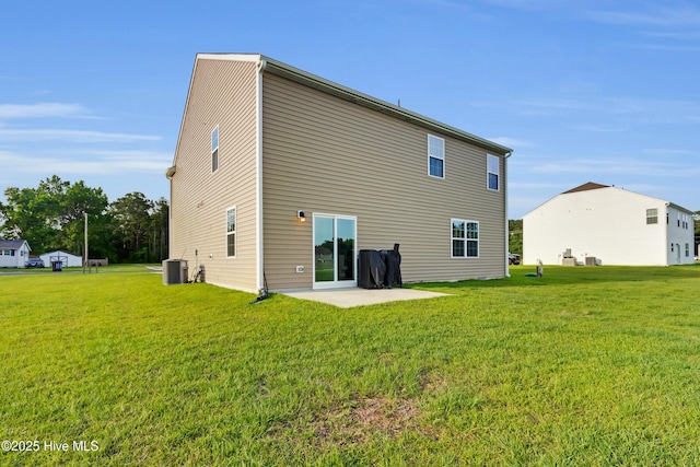 119 Perrytown Loop Rd, New Bern, NC 28562 - back of property with a lawn, central air condition unit, and a patio