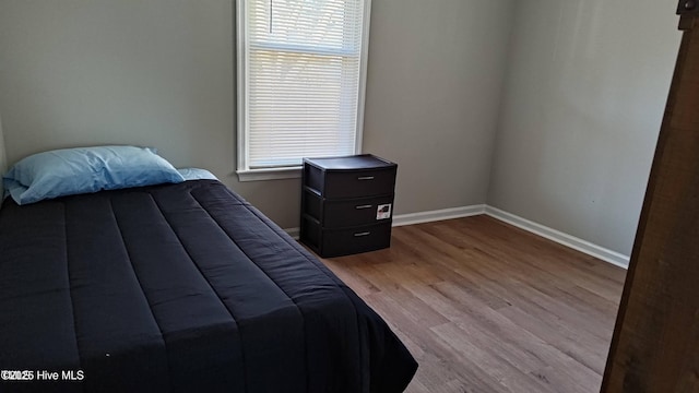 1007 Edmondson Ave, Tarboro, NC 27886 - bedroom with baseboards and wood finished floors