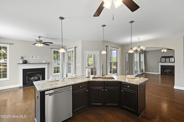 113 Percy Padgett Ct, Holly Ridge, NC 28445 - kitchen with a fireplace with flush hearth, a sink, ceiling fan, and open floor plan