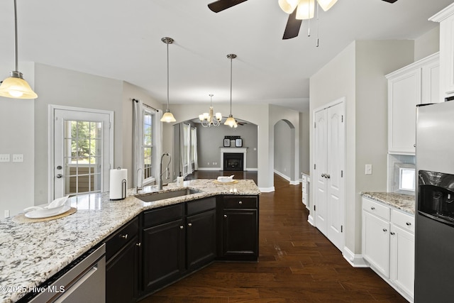 113 Percy Padgett Ct, Holly Ridge, NC 28445 - kitchen with stainless steel appliances, a sink, ceiling fan, dark wood-type flooring, and white cabinets