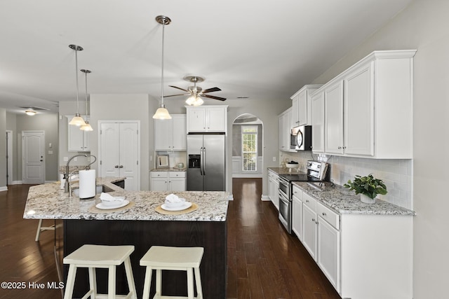 113 Percy Padgett Ct, Holly Ridge, NC 28445 - kitchen featuring appliances with stainless steel finishes, a sink, white cabinets, and dark wood-style floors