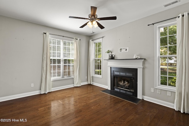 113 Percy Padgett Ct, Holly Ridge, NC 28445 - unfurnished living room featuring wood finished floors, a fireplace, healthy amount of natural light, and baseboards
