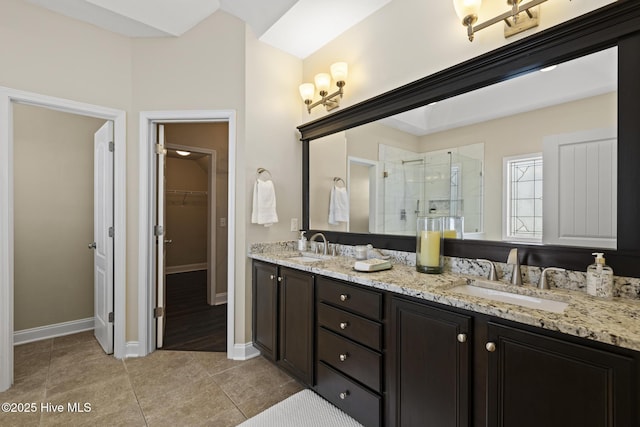 113 Percy Padgett Ct, Holly Ridge, NC 28445 - full bath featuring a stall shower, double vanity, a walk in closet, tile patterned flooring, and baseboards