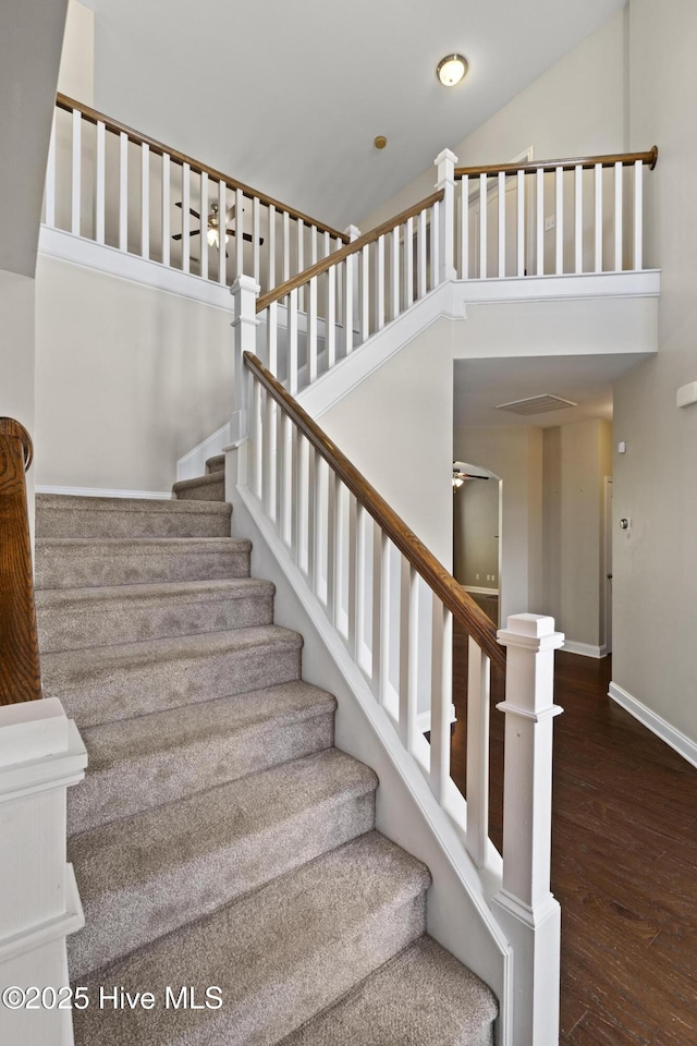 113 Percy Padgett Ct, Holly Ridge, NC 28445 - stairway featuring a towering ceiling, wood finished floors, and baseboards