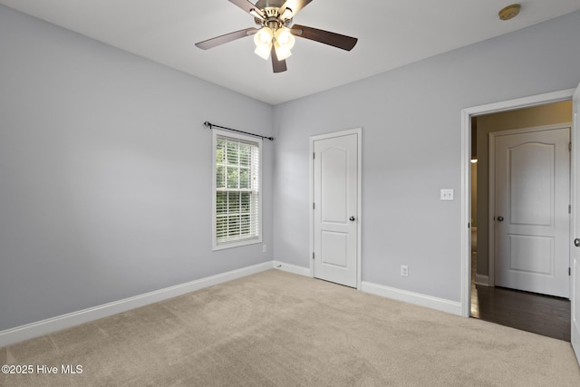 113 Percy Padgett Ct, Holly Ridge, NC 28445 - unfurnished bedroom with carpet floors, baseboards, and ceiling fan