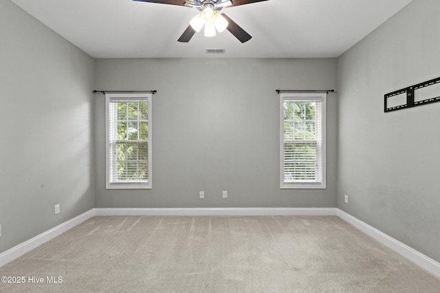 113 Percy Padgett Ct, Holly Ridge, NC 28445 - empty room with healthy amount of natural light, light colored carpet, and a ceiling fan