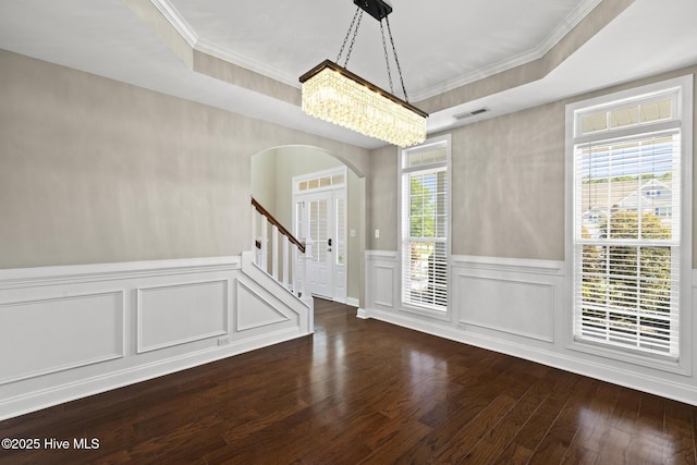 113 Percy Padgett Ct, Holly Ridge, NC 28445 - spare room featuring arched walkways, a chandelier, crown molding, plenty of natural light, and wood finished floors