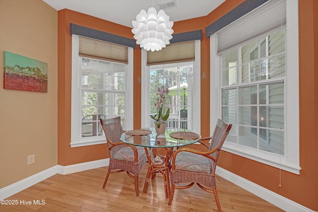 3878 White Blossom Cir, Southport, NC 28461 - dining room with baseboards and wood-type flooring