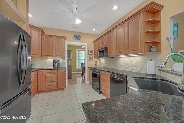 3878 White Blossom Cir, Southport, NC 28461 - kitchen featuring black appliances, a sink, open shelves, ceiling fan, and dark stone countertops