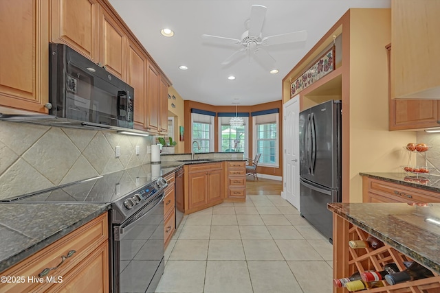 3878 White Blossom Cir, Southport, NC 28461 - kitchen with black appliances, light tile patterned flooring, ceiling fan, a sink, and recessed lighting