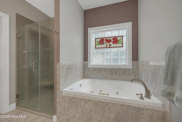 3878 White Blossom Cir, Southport, NC 28461 - bathroom with a stall shower, a jetted tub, and tile patterned floors
