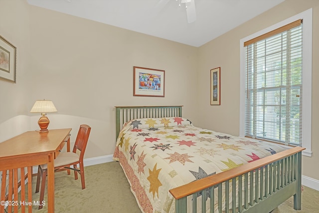 3878 White Blossom Cir, Southport, NC 28461 - carpeted bedroom with multiple windows, baseboards, and a ceiling fan